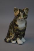 A WINSTANLEY CAT, seated, with glass eyes, height 18.5cm (slight chip to ear)