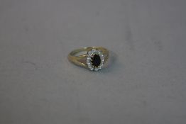 A 9CT DIAMOND AND SAPPHIRE RING, ring size M, approximate size 2.0 grams