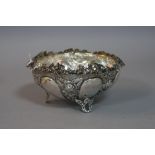 A GREEK SILVER EMBOSSED DISH, with vine leaf decoration to the top, impressed 'EPT XEIPOE',