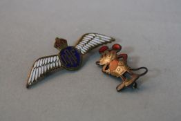 AN R.A.F. WINGED BADGE, together with an early Mickey Mouse with red enamel