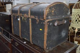 A VINTAGE DOMED TOPPED TRAVELLING TRUNK (sd)