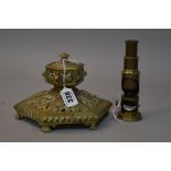 A BRASS INKWELL AND A STUDENTS MICROSCOPE (2)
