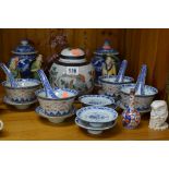 A COLLECTION OF CHINESE AND JAPANESE CERAMICS, including rice bowls, ladles and saucers, blue and