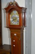 A SLIM MODERN MAHOGANY GRANDDAUGHTER CLOCK, Tempus Fugit to face, approximate height 183cm (key,