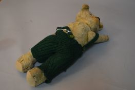 A GOLDEN PLUSH TEDDY BEAR, horizontal stitched nose, shaved muzzle, plastic eyes, jointed body,
