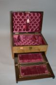 A BURR WALNUT TRAVELLING BOX, with padded interior and pull-out fitted writing slope and letter rack