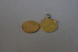 A 1912 HALF SOVEREIGN, with a 1914 half sovereign in a mount, approximate weight 8.5 grams