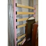 A METAL PINK SINGLE BED FRAME