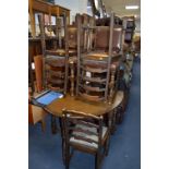 AN OAK GATE LEG TABLE AND FOUR LADDER BACK CHAIRS and three leather seated chairs (8)