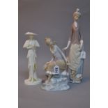 TWO LLADRO FIGURES, seated girl on rock by water and fish and a lady with parasol and dog,