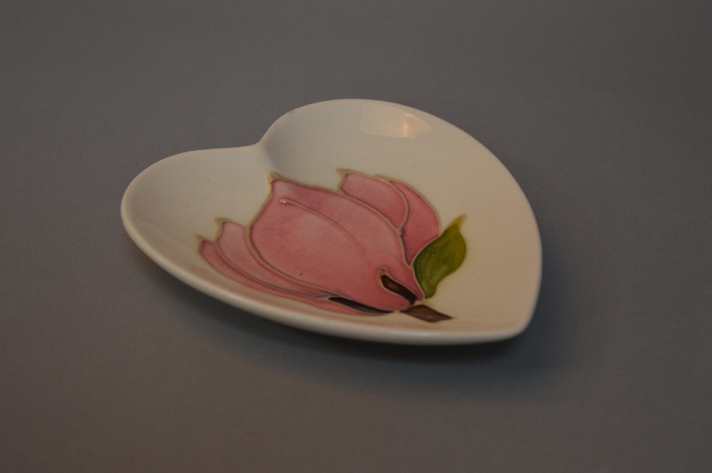 A MOORCROFT POTTERY HEART SHAPED TRINKET DISH, Magnolia pattern on cream ground, impressed marks