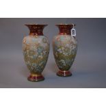 A PAIR OF DOULTON LAMBETH SLATER STONEWARE VASES, with impressed backstamps and 1029 and painted