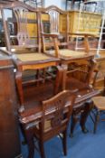 A MAHOGANY PULL OUT DINING TABLE, including one leaf, approximate size width 140cm x depth 110cm x