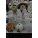 TWELVE GLASS LIGHT SHADES, a Bourne Denby moulded vase and a circular wall clock