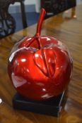 A MODERN GLAZED TABLE CENTRE PIECE, of a red apple