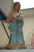 AN EARLY 20TH CENTURY PAINTED PLASTER FIGURE OF THE VIRGIN MARY, modelled kneeling in prayer,