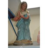 AN EARLY 20TH CENTURY PAINTED PLASTER FIGURE OF THE VIRGIN MARY, modelled kneeling in prayer,