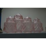 A SET OF THREE PINK GLASS ART DECO MOULDED GLASS LIGHT SHADES, and a fourth larger matching
