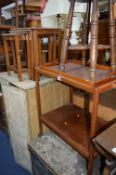 TEA TROLLIES, a nest of four walnut tables, a folding tray table and a magazine rack, etc (7)