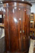 A VICTORIAN AND INLAID BARROLL FRONT TWO DOOR HANGING CORNER CUPBOARD (key)