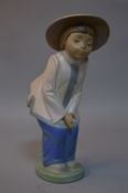 A NAO FIGURE OF JAPANESE CHILD BOWING, height approximate 30cm
