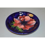 A MOORCROFT POTTERY DISH, Clematis pattern, impressed and painted backstamp and signature to base,