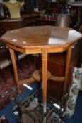 AN EDWARDIAN ROSEWOOD FINISH AND INLAID OCTAGONAL OCCASIONAL TABLE, united by an undertier (sd)
