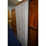 A BLEACHED PINE EFFECT MODERN WARDROBE