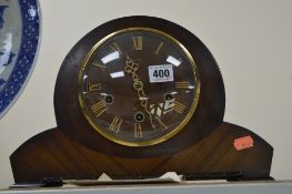 A WALNUT CASED MANTEL CLOCK, Westminster chime, with key and pendulum