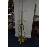 AN EARLY 20TH CENTURY BRASS TELESCOPIC STANDARD LAMP, with triple scrolled arms, approximate size