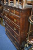 A GEORGIAN OAK CHEST, of two short and four long drawers with brass drop down handles, approximate