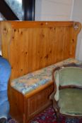 A LARGE PINE SETTLE, above three cupboard doors, approximate size width 183cm x height 143cm x depth