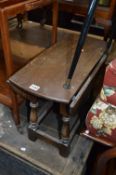 A SMALL OAK GATELEG TABLE, and an oak stool with cross stretchered support (2)