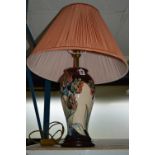 A MOORCROFT POTTERY TABLE LAMP, Red Tulip design, with shade (some crazing), height approximately