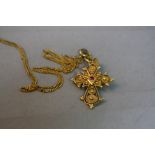 AN 18CT CROSS, approximate weight 3.9 grams on a yellow metal chain, approximate weight 2.2 grams