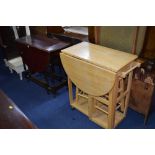 A MAHOGANY DROP LEAF TABLE and a modern kitchen trolley with two stools (2)