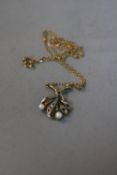 A 9CT PEARL GEM SET FLOWER PENDANT AND CHAIN, approximate weight 3.3 grams