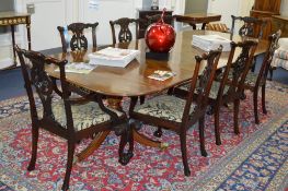 A VICTORIAN STYLE PEDESTAL D-END TABLE, with two extra leafs, brass caps and castors, approximate