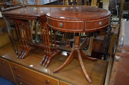 A MODERN MAHOGANY DRUM TABLE, a nest of three tables, kneeling stool and a Toyota sewing machine (