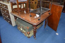 A VICTORIAN MAHOGANY WIND OUT DINING TABLE, with one extra leaf, approximate size with leaf width