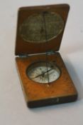 A MINIATURE COMPASS AND SUNDIAL, in a wooden case