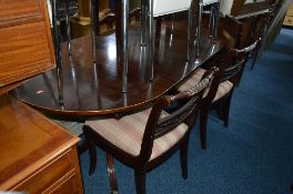 A MODERN MAHOGANY PEDESTAL TABLE, four chairs including two carvers and a sideboard (8)