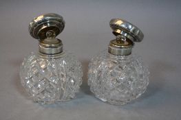 A PAIR OF SILVER TOPPED SCENT BOTTLES (2)