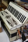 AN ITALIAN 'GERALDO STANDARD' PIANO ACCORDIAN, faux mother of pearl and white plastic covered