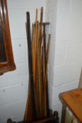 A COLLECTION OF SNOOKER EQUIPMENT, to include a quantity of cues, balls, two framed snooker rules