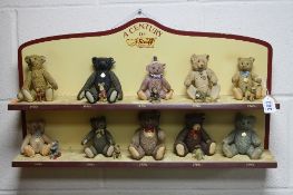 TEN ENESCO STEIFF COLLECTORS PORCELAIN AND PEWTER TEDDY BEAR FIGURES, with a stand 'A Century of