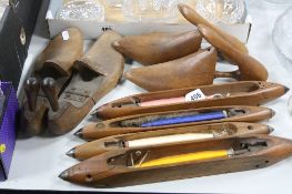 FOUR BOAT SHAPED WEAVING SHUTTLES WITH BOBBINS, marked Greenwood & Co, Bancroft etc, together with