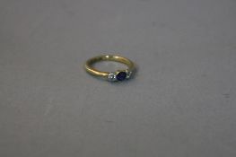 AN 18CT SAPPHIRE AND DIAMOND RING, ring size I, approximate weight 2.6 grams