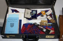 A CASE OF MASONIC ITEMS, including one silver medal, three other medals, etc