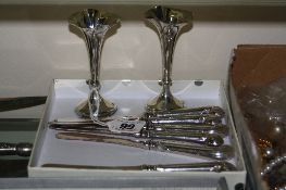 A PAIR OF SILVER VASES, and six butter knives